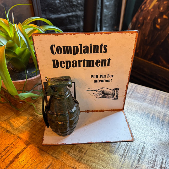 Antiqued Metal Complaints Department Table Sign with Grenade