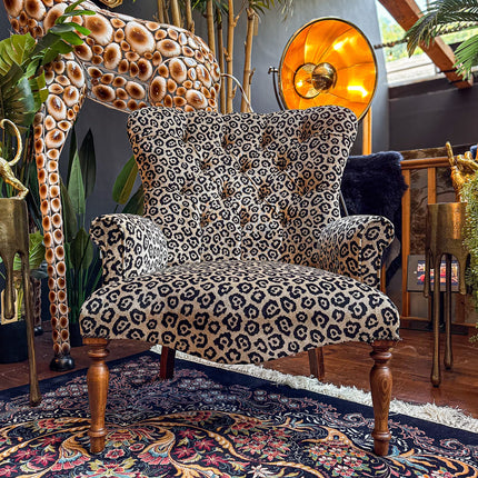 Selfridges Buttoned Wing Back Chair in Animal Velvet