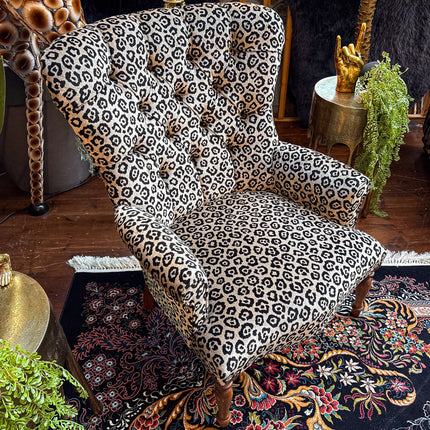 Selfridges Buttoned Wing Back Chair in Animal Velvet