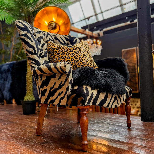 Selfridges Buttoned Wing Back Chair in Animal Velvet